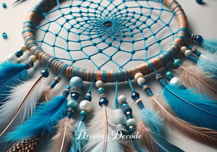 color dream catcher meaning _ A close-up of a nearly completed dream catcher, now incorporating blue threads representing calmness and stability. Small beads and feathers are being added, enhancing its aesthetic and symbolic value.